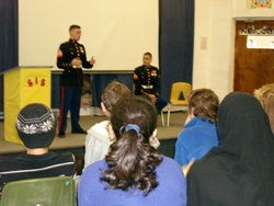SGT. Alex Dunn and CPL Luis Cardona speak to a group of high school students at Sana’a’s International School (SIS)